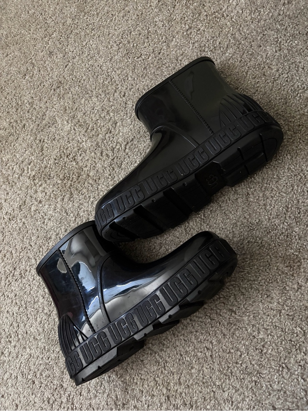Women’s UGG rain boots.